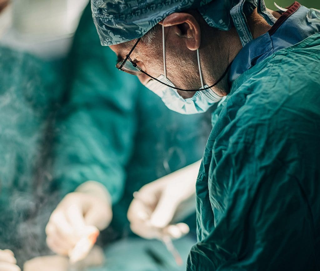 a doctor wearing surgical gear and mask